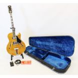 A Yamaha AE11 Semi-Acoustic guitar, probably circa 1969, in original hard case, with lead, tuner,