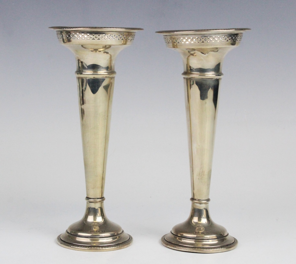 A pair of George V silver posy vases by Walker & Hall, Sheffield 1919, each of trumpet form with