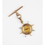 A Victorian 15ct gold fob compass in the form of a ship's wheel, the reverse decorated with enamel