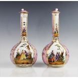 A pair of Helena Wolfsohn porcelain bottle vases and covers, each typically decorated with quartered