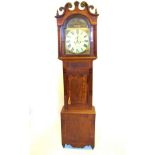 An early 19th century eight day mahogany longcase clock, the 34cm break arch painted dial, centred