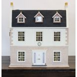 A Georgian style dolls house, late 20th century, the hinged house front and roof opening to six