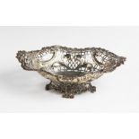 A Victorian silver pedestal dish by William Comyns, London 1891, of oval form with moulded scrolling