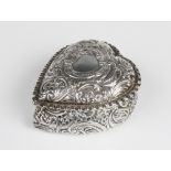 A Victorian heart shaped silver box by William M Hayes, Birmingham 1897, with embossed scrolling
