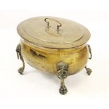 A 19th century brass coal or log bin, of oval cauldron form, the removable cover centred with a