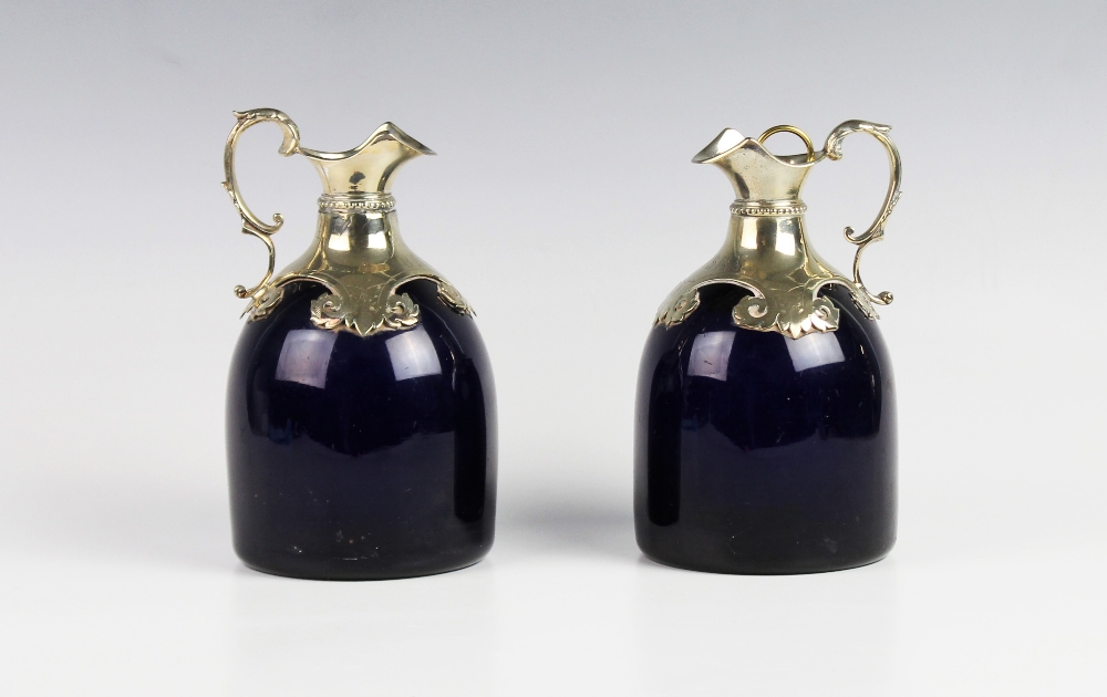 A white metal mounted Bristol blue glass spirit decanter, 19th century, the blue glass body of