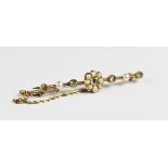 An Edwardian diamond and pearl set 15ct gold bar brooch, the central floral cluster comprising an