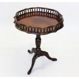 A 19th century and later Chippendale style mahogany tripod table, the shaped top with a repeating