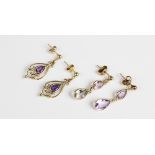 A pair of amethyst set drop earrings, each comprising two teardrop shaped amethysts set in yellow