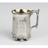 A Victorian silver mug by H J Lias & Son, London 1857, of faceted cylindrical form with leaf-