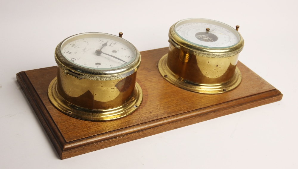 A Schatz Royal Mariner reproduction brass cased ships clock, with a two-train alarm movement, 16cm