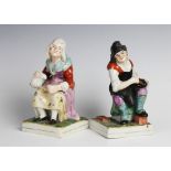 A pair of Staffordshire figures, 19th century, modelled as a cobbler and his wife, 16cm high (2)