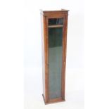 An early 20th century oak glazed cabinet, 134cm H x 30cm D x 21.5cm D