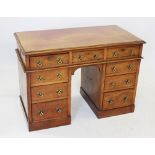 A Victorian mahogany twin pedestal kneehole desk, the rectangular moulded top over three frieze