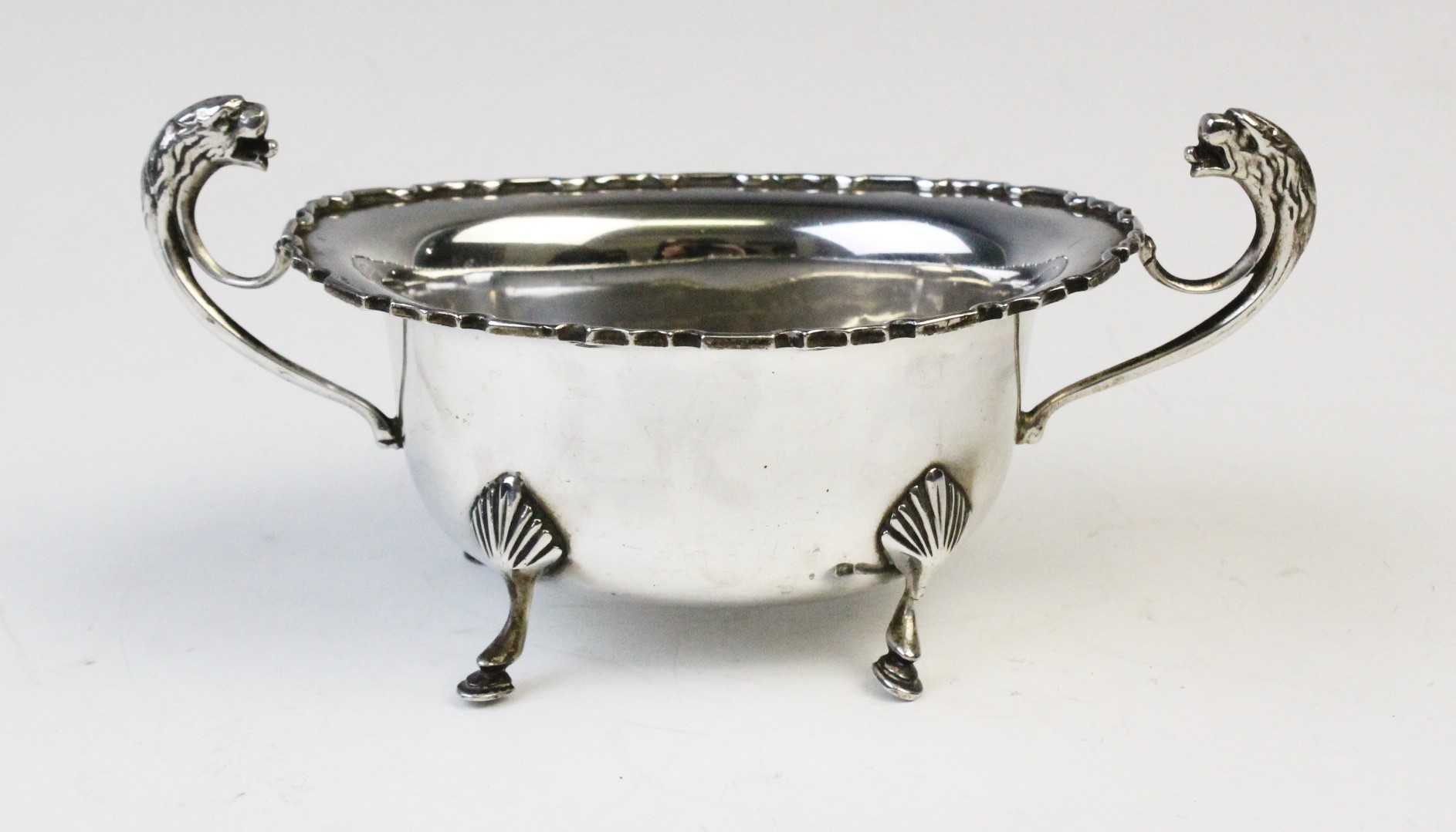 A George V twin-handled silver sugar bowl by E Hill, Birmingham 1934, of oval form with shaped - Image 2 of 4