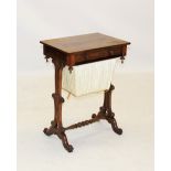 A mid 19th century rosewood sewing table, having a single frieze drawer opposed by a faux drawer,