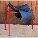 A vintage Wycherley of Malpas leather saddle and a further pony size saddle (trees unchecked) (at