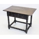 A 17th century oak plank top side table, circa 1650, the triple plank top above a single