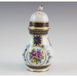 A Dresden porcelain caster, 19th century, of baluster form with threaded and pierced domed cover,