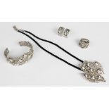 A suite of silver gemstone set jewellery, comprising a pendant, bracelet, ring and earrings, each