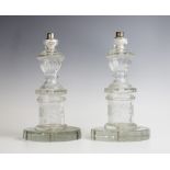 A pair of glass candlesticks, early 20th century, later drilled and mounted as lamp bases, the necks