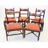 A set of four Regency mahogany dining chairs, each with a rope twist rail above a drop in seat,