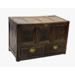 An 18th century and later carved oak mule chest, with three carved panels