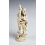 A Japanese signed ivory okimono, Meiji period (1868-1912), the figurative carving modelled depicting