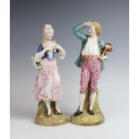 A pair of Continental porcelain allegorical figures, 19th century, modelled as a lady holding a dove