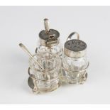 A late Victorian three-piece silver and cut glass cruet set and stand by Hukin & Heath, London 1899,