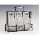 A silver plated three-bottle tantalus with Hobbs & Co London lock, of rectangular form with