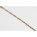 A diamond set line bracelet, comprising ten concave yellow metal links interspersed by eleven