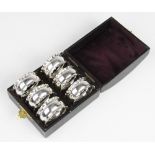 A set of six George V silver napkin rings by Henry Moreton, Birmingham 1911, each of circular form