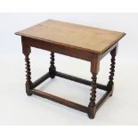 A 17th century style oak side table, 19th century, the rectangular moulded top raised upon barley