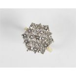 A diamond cluster ring, the hexagonal shaped cluster comprising nineteen round brilliant cut