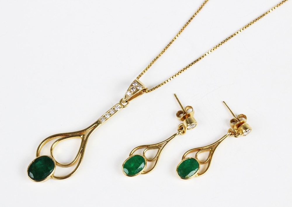 An emerald and diamond pendant and earring suite, the pendant comprising an oval mixed cut emerald - Image 2 of 4