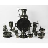 A collection of pewter, 18th century and later, to include a water jug, 22.5cm high, two lidded