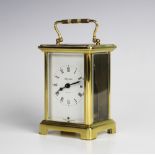 A French lacquered brass eight day carriage timepiece by Bayard, with a 6cm white enamelled dial,