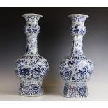 A pair of Delft tin-glazed earthenware blue and white Altar vases, each of large octagonal form