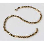A Victorian chain, in a scrolling star-pierced link design, with spring ring and loop fastening,