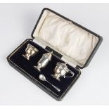 A George V silver three-piece condiment set by Deakin & Francis, Birmingham 1916, comprising wet