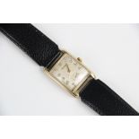 A vintage 9ct gold Rotary wristwatch, the rectangular cream coloured dial with Arabic numerals and