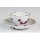 A Meissen porcelain tea cup and saucer circa 1775, finely painted with views of courting couples