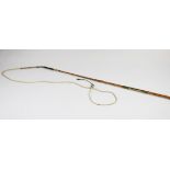 An early 20th century carriage whip by Swaine and Adeney, with a leather handle and gilt metal mount