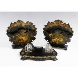 A Victorian papier mache desk tidy, the nib box with removable cover flanked by glass ink wells, and
