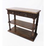 A Victorian oak and marble top buffet, the rectangular hinged top with a carved border enclosing a
