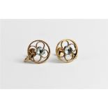 A pair of zircon set 9ct gold earrings, each comprising a central round mixed cut light blue