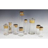 A collection of nine 19th century and later glass apothecary jars, six with cork stoppers and a