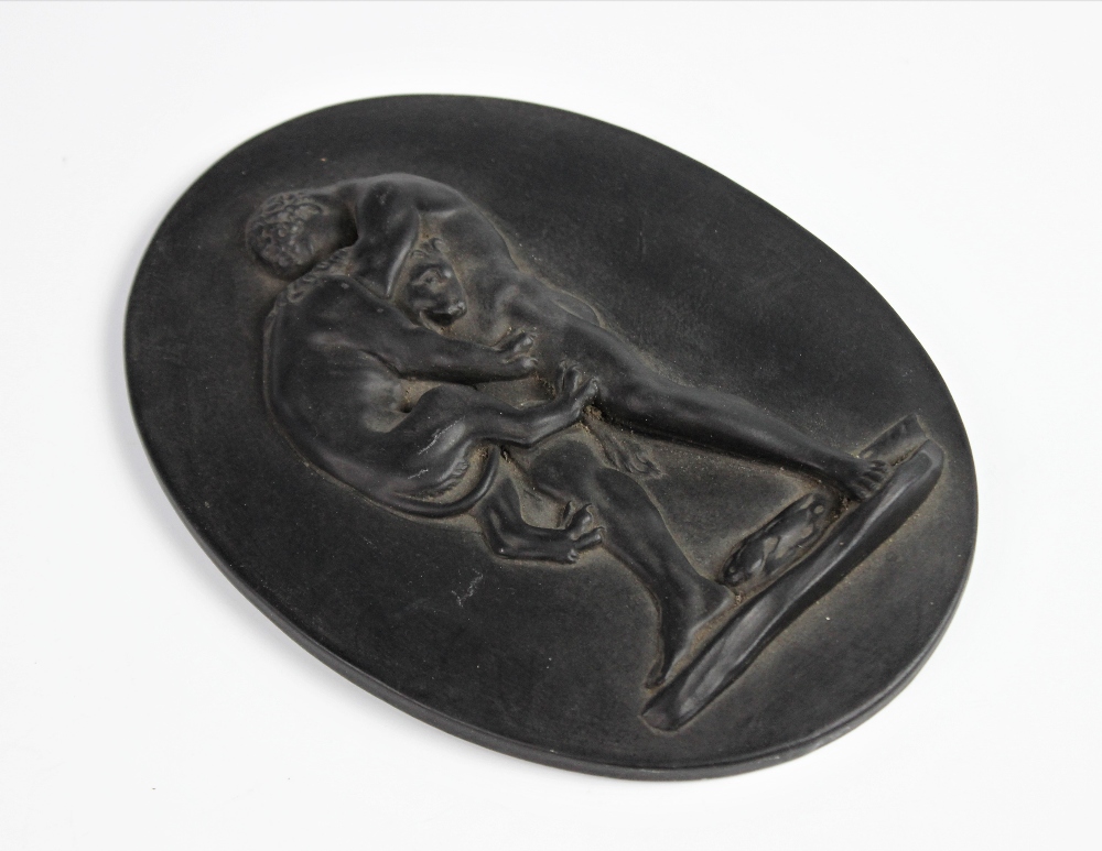 A Wedgwood black basalt oval plaque, 19th century, depicting Hercules strangling the Nemean Lion, - Image 2 of 3