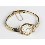 A lady's Seiko quartz wristwatch on 9ct gold strap, the round white dial with Arabic numeral, set to